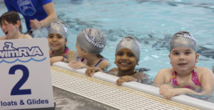 Swimmer smiling from the pool edge